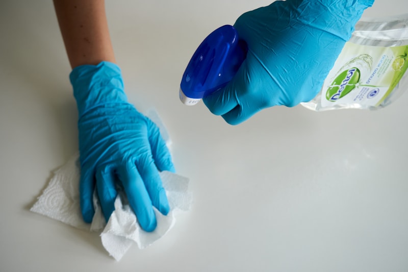Person scrubbing and cleaning a floor
